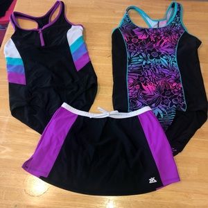 2 swim suits with matching skirt size 14